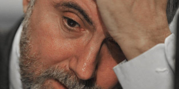 Professor of Economics and International Affairs at Princeton University, New York Times columnist, and 2008 Nobel Peace Prize winner in Economics, Paul Krugman, listens to his introduction before delivering remarks February 11, 2009 at the Institute for America's Future 'Thinking Big, Thinking Forward' conference on America's economic future at the Capitol Hilton in Washington, DC. AFP Photo/Paul J. Richards (Photo credit should read PAUL J. RICHARDS/AFP/Getty Images)