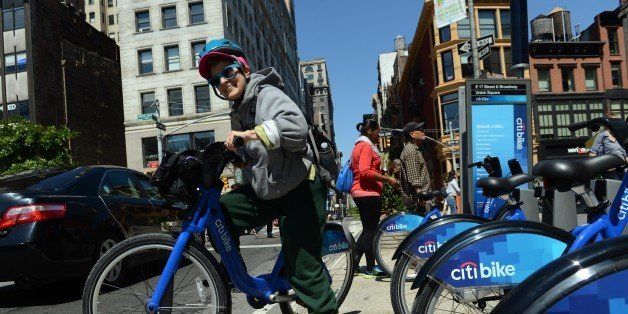 With AFP Story by Brigitte DUSSEAU: US-Transport-Bicycle-Share-CitiBikeLaura Glenn-Hershey rides a Citi Bike bicycle from a station near Union Square as the bike sharing system is launched May 27, 2013 in New York. About 330 stations in Manhattan and Brooklyn will have thousands of bicycles for rent. AFP PHOTO/Stan HONDA (Photo credit should read STAN HONDA/AFP/Getty Images)