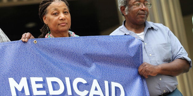 BATON ROUGE, LA - APRIL 02: People are seen outside after a court session on April 2, 2014 in Baton Rouge, Louisiana. MoveOn pedges to continue medicaid fight after billboard hearing in Louisiana. (Photo by Tyler Kaufman/Getty Images for MoveOn)