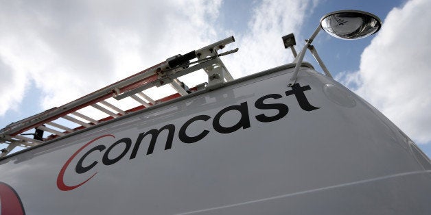 POMPANO BEACH, FL - FEBRUARY 13: A Comcast truck is seen parked at one of their centers on February 13, 2014 in Pompano Beach, Florida. Today, Comcast announced a $45-billion offer for Time Warner Cable. (Photo by Joe Raedle/Getty Images)