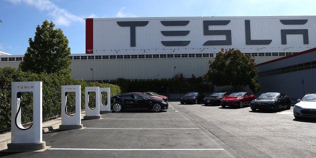 FREMONT, CA - AUGUST 16: A row of new Tesla Superchargers are seen outside of the Tesla Factory on August 16, 2013 in Fremont, California. Tesla Motors opened a new Supercharger station with four stalls for public use at their factory in Fremont, California. The Superchargers allow owners of the Tesla Model S to charge their vehicles in 20 to 30 minutes for free. There are now 18 charging stations in the U.S. with plans to open more in the near future. (Photo by Justin Sullivan/Getty Images)