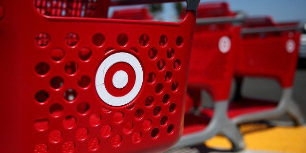 SAN RAFAEL, CA - AUGUST 18: Shopping carts sit in front of a Target store on August 18, 2014 in San Rafael, California. Target announced plans to keep 900 of its stores open until 11pm or midnight in an effort to attract late night shoppers. Target stores now close at 10pm during the week and 9pm on Sundays. (Photo by Justin Sullivan/Getty Images)