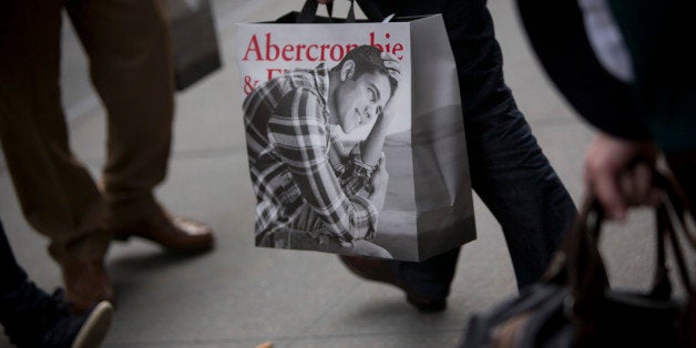 A customer carries an Abercrombie & Fitch Co. shopping bag from one of the company's locations in New York, U.S., on Wednesday, Nov. 6, 2013. Abercrombie & Fitch Co. fell the most in more than two months after posting fiscal third-quarter sales that trailed analysts estimates as teens restrained spending on clothing. Photographer: Scott Eells/Bloomberg via Getty Images