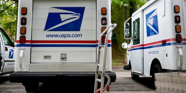 U.S. Postal Service delivery trucks sit at the Brookland Post Office in Washington, D.C., U.S., on Thursday, May 9, 2013. The USPS is projecting a loss of as much as a $6 billion for the year as it keeps pressure on Congress for help, Postmaster General Patrick Donahoe said this month. The service is scheduled to release second-quarter results May 10. Photographer: Andrew Harrer/Bloomberg via Getty Images