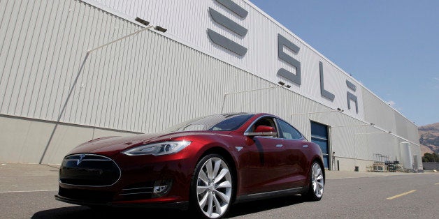 FILE - This June 22, 2012 file photo shows a Tesla Model S outside the Tesla factory in Fremont, Calif. Tesla Motors Inc. on