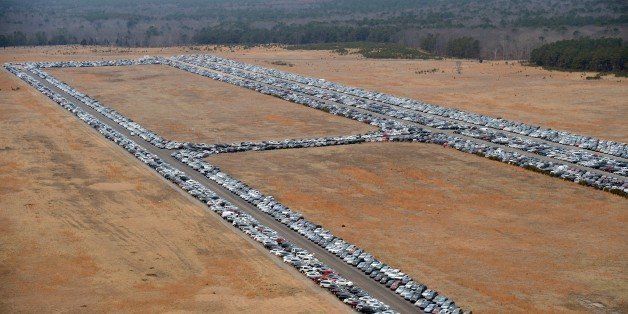 Tens of thousands of vehicles damaged by super storm Sandy are being temporarily stored on runways and taxiways at Calverton Executive Airpark in Calverton, New York, on January 9, 2013 in this aerial view. Insurance Auto Auctions Inc, a salvage auto auction company specializing in total-loss vehicles, acquired the cars and trucks that were damaged, destroyed or flooded by the storm and needed a place to store them. The company made a deal with the Town of Riverhead to lease the airport land and then the vehicles are auctioned online. AFP PHOTO/Stan HONDA (Photo credit should read STAN HONDA/AFP/Getty Images)