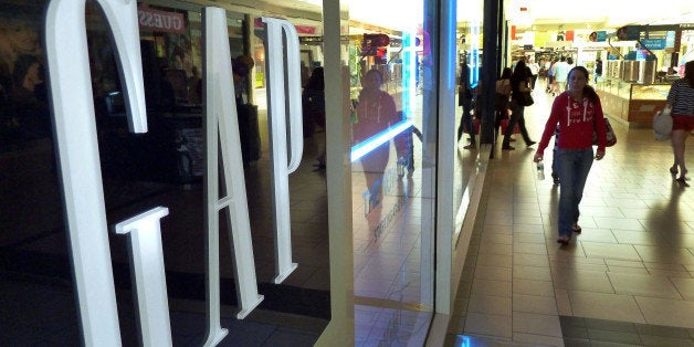 FILE-In this May 14, 2012 file photo, shoppers walk by the GAP store at a shopping mall in Peabody, Mass. Doris Fisher and he
