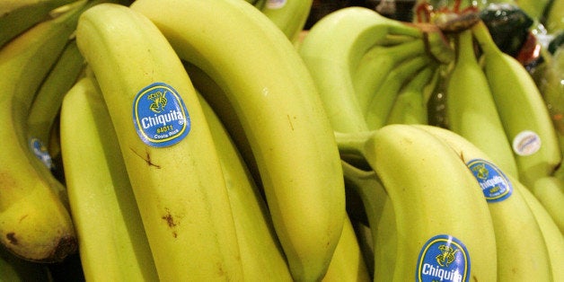 **FILE** Chiquita bananas are piled on display at the Heinen's grocery store in Bainbridge, Ohio in this Aug. 3, 2005 file photo. Victims of Colombia's bloody civil conflict filed an almost $8 billion lawsuit against the U.S. banana importer Chiquita Brands International Inc. on Wednesday, Nov. 14, 2007 for making payments to a paramilitary group responsible for thousands of killings. (AP Photo/Amy Sancetta, file)