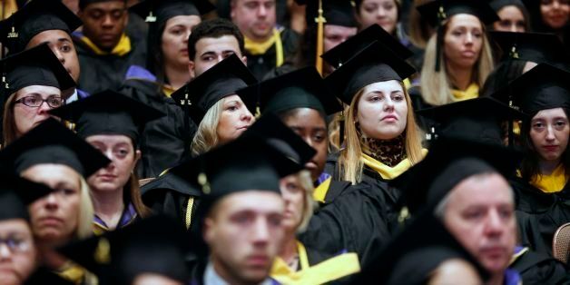 Graduates listen during commencement ceremonies for Fisher College in Boston, Saturday, May 10, 2014. (AP Photo/Michael Dwyer)