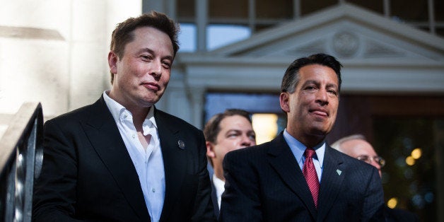 CARSON CITY, NEVADA- SEPTEMBER 4: Tesla Motors CEO Elon Musk, left, and Nevada Gov. Brian Sandoval, right, at a press conference at the Nevada State Capitol, September 4, 2014 in Carson City, Nevada. Musk and Gov. Sandoval announced a plan to build a Tesla Gigafactory in Nevada to produce batteries for electric vehicles providing 6,500 jobs to the state. (Photo by Max Whittaker/Getty Images)