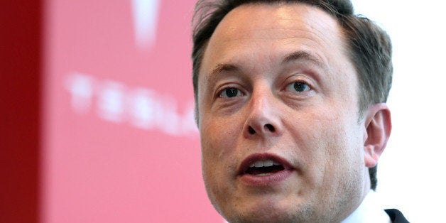 Elon Musk, co-founder and chief executive officer of Tesla Motors Inc., speaks during a news conference in Tokyo, Japan, on Monday, Sept. 8, 2014. Tesla may partner with Toyota Motor Corp. again in the future, Musk said. Photographer: Yuriko Nakao/Bloomberg via Getty Images