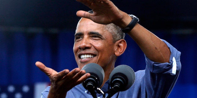 President Barack Obama gestures as he speaks at Laborfest 2014 at Henry Maier Festival Park in Milwaukee on Labor Day, Monday, Sept. 1, 2014. (AP Photo/Charles Dharapak)