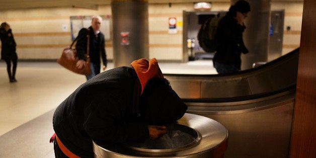 NEW YORK, NY - JANUARY 28: A homeless man is viewed in Penn Station on January 28, 2014 in New York City. Over 3,000 volunteers canvased parks, subways, bus stations and other public spaces early Tuesday morning as part of the New York City Department of Homeless Services annual Homeless Outreach Population Estimate (HOPE), where it tries to gain an accurate estimate of the city's homeless population. The study is part of the federally required Point-In-Time survey, which serves as a snapshot of how many are homeless on any given day in a community. The results are used to devise ways to both better understand the nation's homeless population and ways to assist them in getting off of the streets. According to a recent study by the by the United States Department of Housing and Urban Development, New York City's homeless population increased by 13 percent at the beginning of 2013. Despite an improving local economy, as of last January an estimated 64,060 homeless people were in shelters and on the street in New York. Only Los Angeles had a larger percentage increase than New York for large cities. (Photo by Spencer Platt/Getty Images)