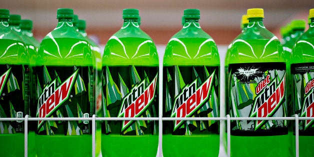 Bottles of PepsiCo Inc. Mountain Dew brand soda sits on display in a supermarket in Princeton, Illinois, U.S., on Friday, Oct. 12, 2012. PepsiCo Inc. is scheduled to release earnings data on Oct. 17. Photographer: Daniel Acker/Bloomberg via Getty Images
