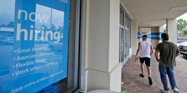 Shoppers walk past a now hiring sign at a Ross store, Friday, May 16, 2014 in North Miami Beach, Fla. Florida gained 34,000 jobs last month, which helped bring the state's unemployment rate back down after it ticked up in March. Florida Gov. Rick Scott, who has been caught up in a tough re-election fight, has made job creation the main theme of his time as governor. He touted the numbers on Friday as more proof that his policies have helped with the state's economic recovery. (AP Photo)