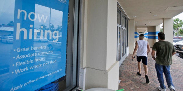 Shoppers walk past a now hiring sign at a Ross store, Friday, May 16, 2014 in North Miami Beach, Fla. Florida gained 34,000 jobs last month, which helped bring the state's unemployment rate back down after it ticked up in March. Florida Gov. Rick Scott, who has been caught up in a tough re-election fight, has made job creation the main theme of his time as governor. He touted the numbers on Friday as more proof that his policies have helped with the state's economic recovery. (AP Photo)