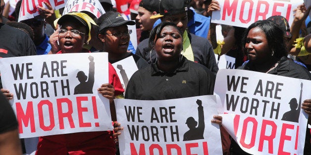 OAK BROOK, IL - MAY 21: Fast food workers and activists demonstrate outside the McDonald's corporate campus on May 21, 2014 in Oak Brook, Illinois. The demonstrators were calling on McDonald's to pay a minimum wage of $15-per-hour and offer better working conditions for their employees. Several protestors were arrested after they entered and ignored police orders to leave the McDonald's campus. McDonald's is scheduled to hold its annual shareholder's meeting tomorrow at the campus. (Photo by Scott Olson/Getty Images)