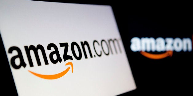 Amazon.com Inc. logos are displayed on laptop computers in Washington, D.C., U.S., on Wednesday, Oct. 23, 2013. Amazon.com In