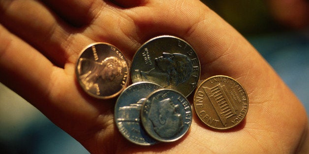 Close-Up Of A Hand Holding Money, Coins, Quarter, Dime, Nickel, Penny. (Photo by Education Images/UIG via Getty Images)