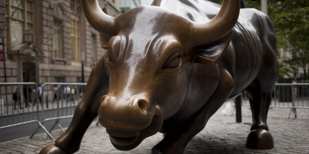 NEW YORK - JUNE 19: A view of the brass Wall Street bull statue stands at a lower Broadway park at Bowling Green June 19, 2012 in New York City's financial district. (Photo by Robert Nickelsberg/Getty Images)