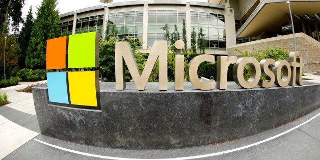This photo taken with a fisheye lens on July 3, 2014 shows Microsoft Corp. signage outside the Microsoft Visitor Center in Re