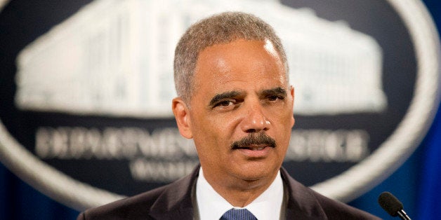 FILE - In this Sept. 4, 2014 file photo, Attorney General Eric Holder speaks during a news conference at the Justice Departme