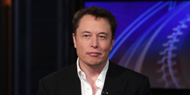 SpaceX billionaire founder and chief executive, and Tesla Motors CEO Elon Musk, is interviewed by Liz Claman during "Countdown to the Closing Bell," on the Fox Business Network, in New York, Wednesday, Sept. 17, 2014. (AP Photo/Richard Drew)