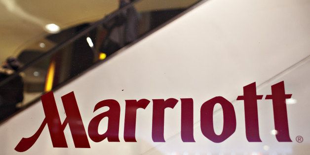 UNITED STATES - FEBRUARY 11: Guests ride an escalator in the background of a Marriott logo on a window outside a Marriott hotel in New York, U.S., on Wednesday, Feb. 11, 2009. Marriott International Inc., the biggest U.S. hotel chain, fell as much as 9.3 percent in early trading after reporting a fourth-quarter loss and forecasting more weakness for the travel industry this year. (Photo by Daniel Acker/Bloomberg via Getty Images)