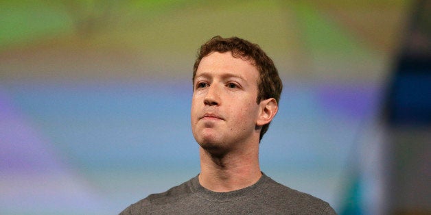 Facebook CEO Mark Zuckerberg gestures while delivering the keynote address at the f8 Facebook Developer Conference Wednesday, April 30, 2014, in San Francisco. (AP Photo/Ben Margot)