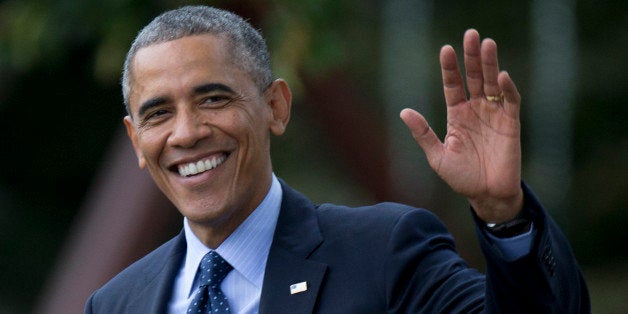 President Barack Obama waves as he walks across the South Lawn of the White House in Washington, Tuesday, Oct. 7, 2014, to board Marine One for a short trip to Andrews Air Force Base, Md., before traveling to New York. (AP Photo/Carolyn Kaster)