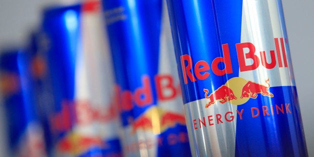 Austrian beverage energy drink cans of Red Bull are pictured in Vienna on March 16, 2013. Red Bull said that an unknown person has been attempting for several weeks to blackmail it by claiming to have contaminated its beverages with faeces. AFP PHOTO / ALEXANDER KLEIN (Photo credit should read ALEXANDER KLEIN/AFP/Getty Images)