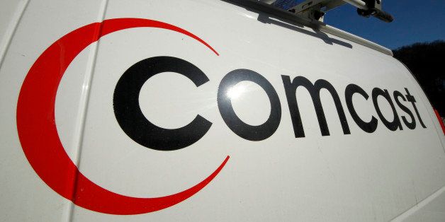 FILE - This Feb. 11, 2011 file photo shows the logo on a Comcast truck in Pittsburgh. Comcast reported on Wednesday Aug. 1, 2012 strong second-quarter earnings from cable operations which overcame returns of the box-office flop "Battleship." (AP Photo/Gene J. Puskar, file)