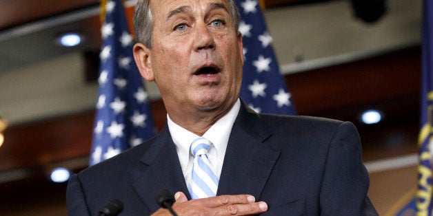 House Speaker John Boehner of Ohio defends the work of the GOP during a brief news conference on Capitol Hill in Washington, Thursday, July 31, 2014, as Congress prepares to leave for a five-week summer recess. The institutional split of a Republican-led House and Democratic-controlled Senate has added up to inaction, especially in a midterm election year with control of the Senate at stake. Lawmakers have struggled to compromise on a handful of bills to deal with the nation's pressing problems amid overwhelming partisanship. (AP Photo/J. Scott Applewhite)