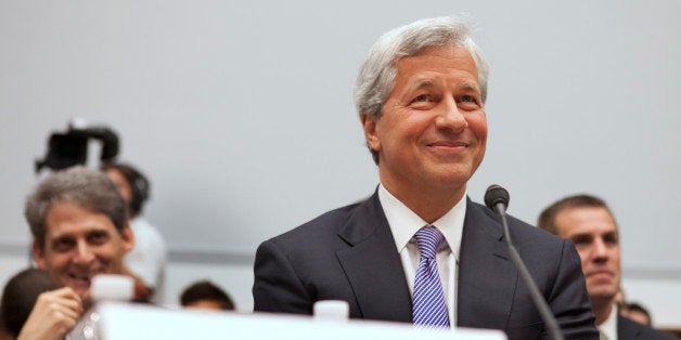 Jamie Dimon, CEO of JPMorgan Chase, smiles while testifying before the House Financial Services Committee on Capitol Hill in