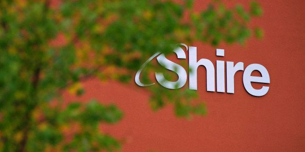 A Shire Plc logo sits on a wall outside the company's offices at the Citywest Business Campus in Dublin, Ireland, on Wednesday, Oct. 15, 2014. AbbVie Inc. is considering scrapping the planned 32.4-billion-pound ($51.5 billion) acquisition of Dublin-based drugmaker Shire in what would be the biggest casualty of the U.S. crackdown on so-called tax inversions. Photographer: Aidan Crawley/Bloomberg via Getty Images