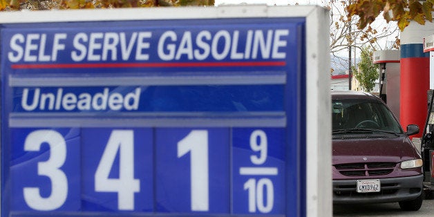 SAN RAFAEL, CA - OCTOBER 15: Gas prices are displayed at a gas station on October 15, 2014 in San Francisco, California. Acc