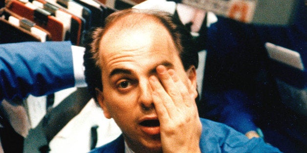 A trader keeps an eye on a terminal at the New York Stock Exchange, Oct. 20, 1987. Stock prices shot higher in heavy trading on the NYSE following yesterday's historic 508-point collapse in the Dow Jones Industrial Average. (AP Photo/Mario Cabrera)