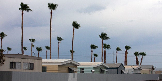 Mobile homes, modular homes and trailers are most commonplace in Yuma, Arizona. This week I've passed by many a park with lots of such homes that are mostly empty this time of year. The "snowbirds" are no longer around as it is reaching 114 degrees daily and will get hotter yet for a few more months. The "snowbirds" that come down for the winter season leave their homes closed up, not even a vehicle is left in the driveway. Very eerie feeling to see so many developments like this in a city. Surrea to be sure.This location is right next door to the hotel I am staying at in Yuma off the 4th Avenue area south of 24th Street.