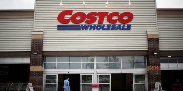 A man enters a Costco Wholesale Corp. store in Louisville, Kentucky, U.S., on Thursday, May 29, 2014. Costco Wholesale Corp., the largest U.S. warehouse-club chain, posted fiscal third-quarter profit that missed analysts' estimates even as comparable sales gained 6 percent. Photographer: Luke Sharrett/Bloomberg via Getty Images