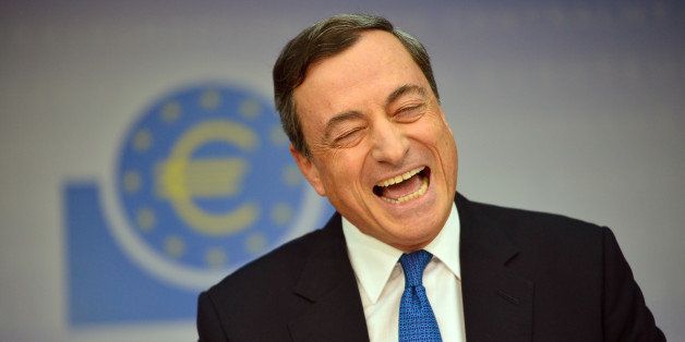 FRANKFURT AM MAIN, GERMANY - NOVEMBER 06: Mario Draghi, President of the European Central Bank, laughs as he speaks to the media following the monthly ECB board meeting on November 6, 2014 in Frankfurt, Germany. This is the last press conference Draghi will hold as the ECB is in the process of moving into its newly-built headquarters away from the central banking district in Frankfurt. (Photo by Thomas Lohnes/Getty Images)