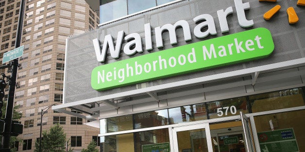 CHICAGO, IL - AUGUST 15: Customers shop at a Walmart Neighborhood Market store on August 15, 2013 in Chicago, Illinois. Walmart, the world's largest retailer, reported a surprise decline in second-quarter same-store sales today. The retailer also cut its revenue and profit forecasts for the fiscal year. (Photo by Scott Olson/Getty Images)