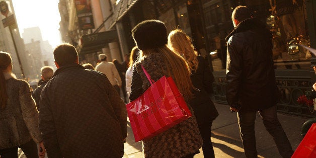 NEW YORK, NY - DECEMBER 02: People carry shopping bags along Broadway on December 2, 2013 in New York City. According to the National Retail Federation, retail spending over the Thanksgiving weekend fell for the first time in at least seven years. The group estimates that total spending over the holiday weekend fell to $57.4 billion, down 2.7% from a year ago despite significant sales and discounts at most major retailers. (Photo by Spencer Platt/Getty Images)