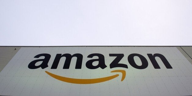 The logo of US online retail giant Amazon is displayed on the Brieselang logistics center, west of Berlin on November 11, 2014. The center is one of nine in Germany. AFP PHOTO / JOHN MACDOUGALL (Photo credit should read JOHN MACDOUGALL/AFP/Getty Images)