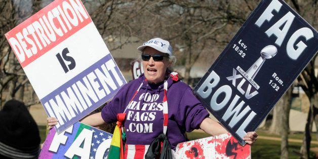 A member of the Westboro Baptist Church makes her point with signs in the free speech area outside the stadium before the start of Super Bowl XLV where the Green Bay Packers face the Pittsburgh Steelers at Cowboys Stadium in Arlington, Texas, Sunday, February 6, 2011. (Sharon Ellman/Fort Worth Star-Telegram/MCT via Getty Images)