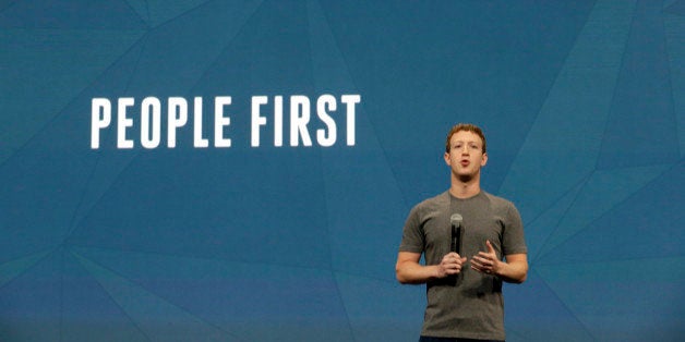 Facebook CEO Mark Zuckerberg gestures while delivering the keynote address at the f8 Facebook Developer Conference Wednesday, April 30, 2014, in San Francisco. (AP Photo/Ben Margot)