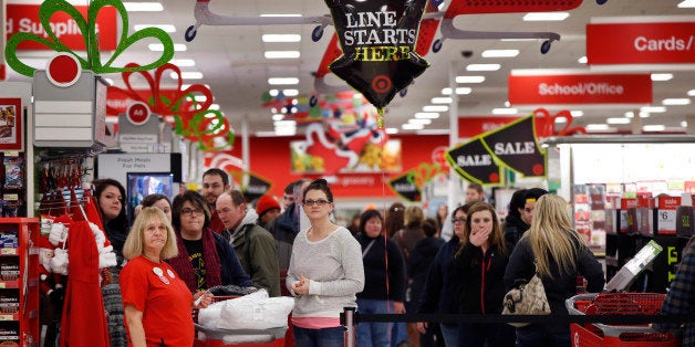 Target shoppers wait to check out on Black Friday, Nov. 28, 2014, in South Portland, Maine. The store opened at midnight. (AP Photo/Robert F. Bukaty)