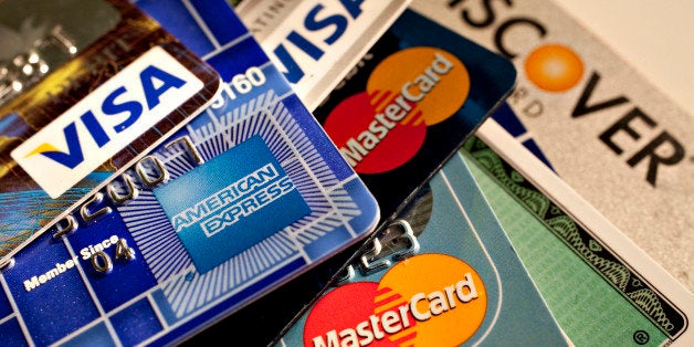 American Express, Discover, MasterCard and Visa credit cards are displayed for a photograph in New York, U.S., on Tuesday, Ma