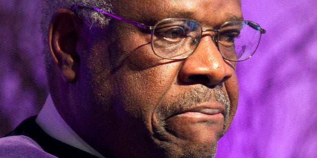 Supreme Court Justice Clarence Thomas pauses while speaking about his time as a student at College of the Holy Cross after receiving an honorary degree from the college, Thursday, Jan. 26, 2012, in Worcester, Mass. (AP Photo/Michael Dwyer)