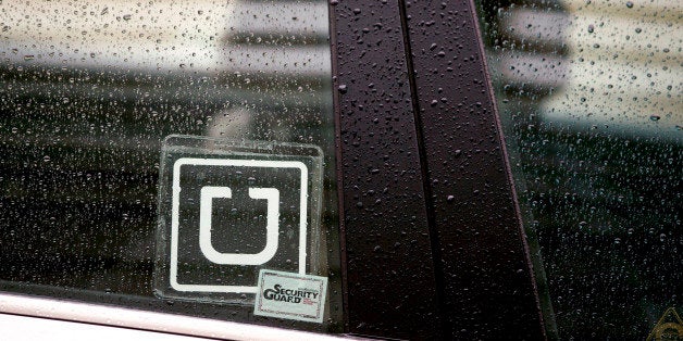 The Uber Technologies Inc. logo is displayed on the window of a vehicle after dropping off a passenger at Ronald Reagan Natio