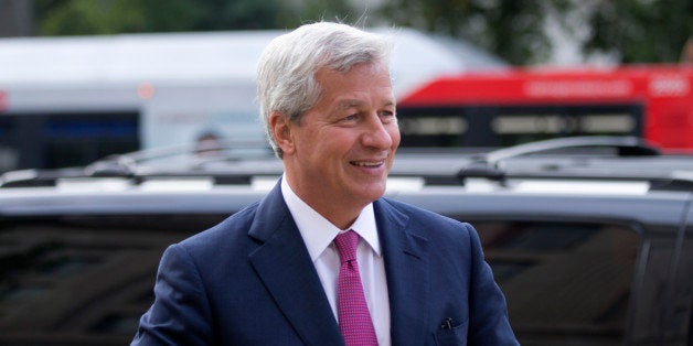 JPMorgan Chase Chairman, President and CEO Jamie Dimon, arrives at the Justice Department in Washington, Thursday, Sept. 26, 2013. An $11 billion national settlement is under discussion to resolve claims over JPMorgan's handling of mortgage-backed securities in the run-up to the recession, said a government official familiar with ongoing negotiations among bank, federal and New York state officials. (AP Photo/Manuel Balce Ceneta)